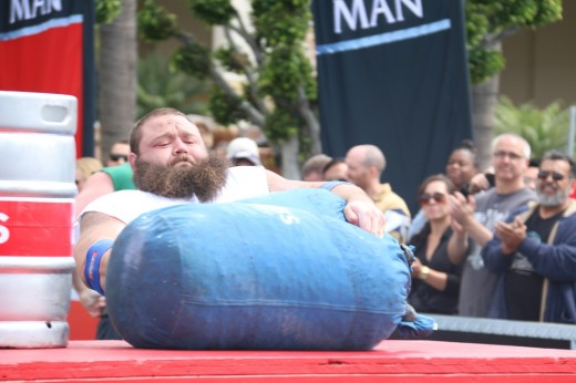 1. Robert Oberst struggling to lift a sack onto a table