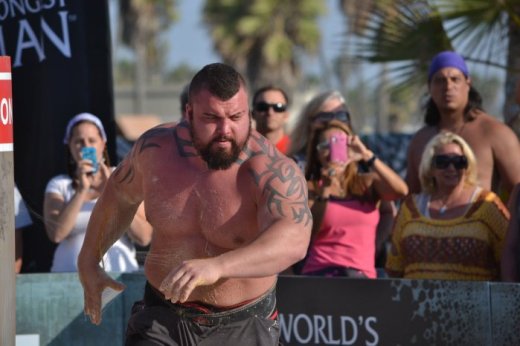 3. Eddie Hall covered in sticky glue running between lifts