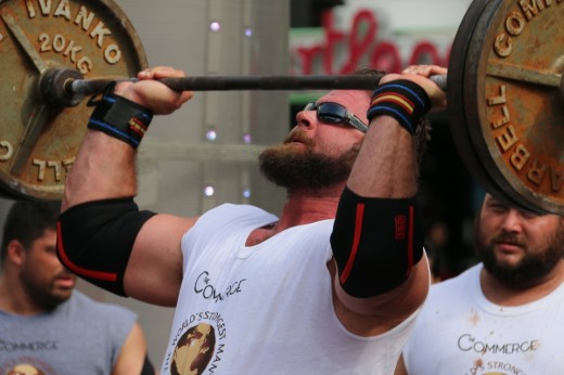 4. Mike Burke lifting a bar above his head