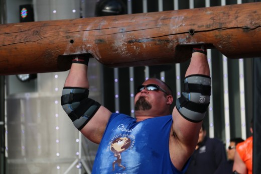 7. Brian Shaw lifting a log above his head